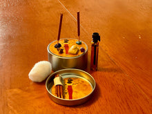 Load image into Gallery viewer, Traveling Altar. Tiny tin filled with elements, incense, crystals and Bastet offerings. Handmade. Amazingly cute.
