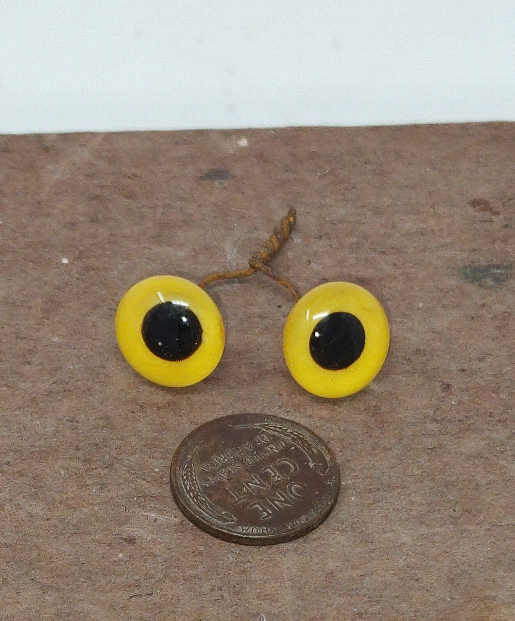 ONE pair of Antique Yellow Glass Eyes