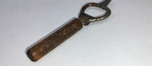 Load image into Gallery viewer, Early 1900’s Liquor Store Bottle Opener, Wooden Handle. The Freeman. OK? NJ?
