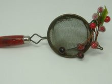 Load image into Gallery viewer, OOAK Christmas Decoration Made From Vintage Wooden Red Handle Utensil. Ornament made from upcycled red handled strainer.
