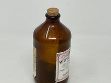 Load image into Gallery viewer, Antique Amber Bottle with Witch Powders Label.
