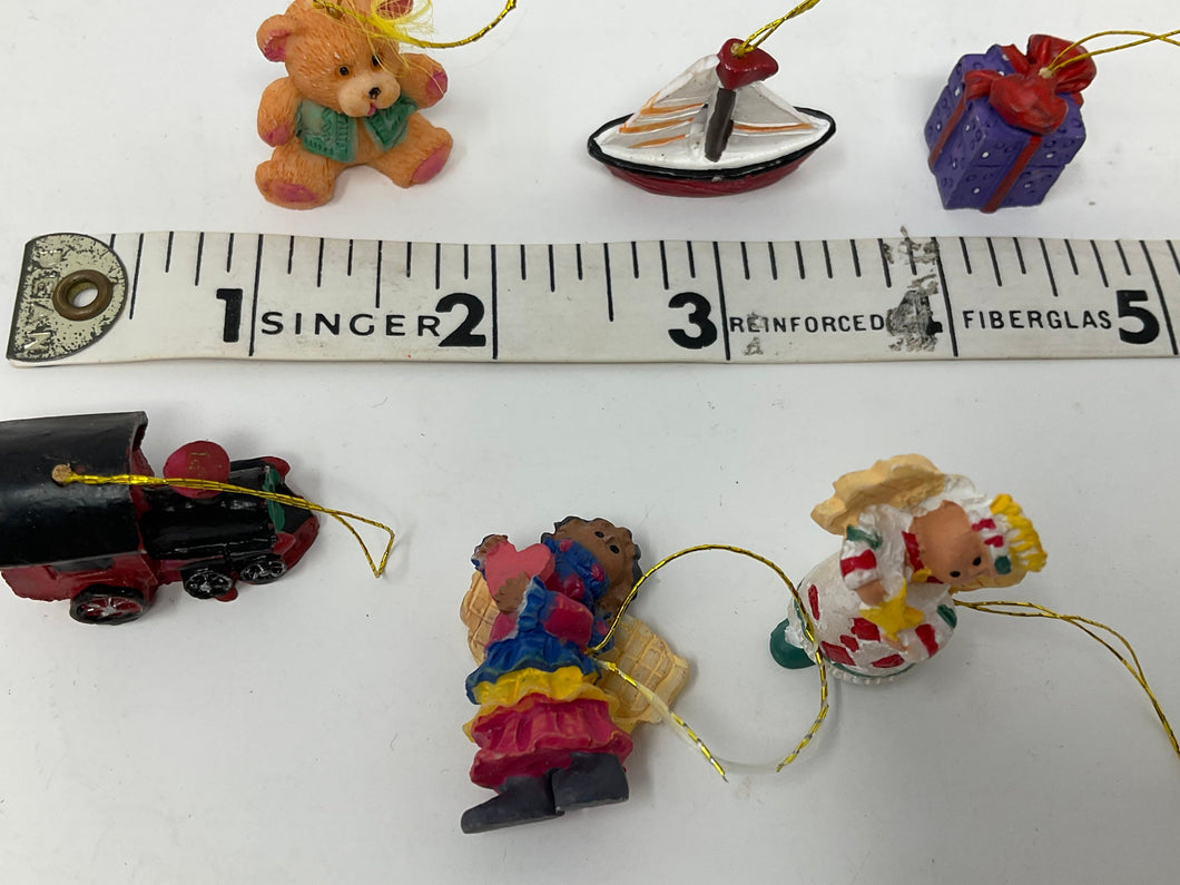 Itty, bitty, teeny tiny ornaments. Miniature tree ornaments. 1990s. Resin boat, train, teddy ear, present, etc.