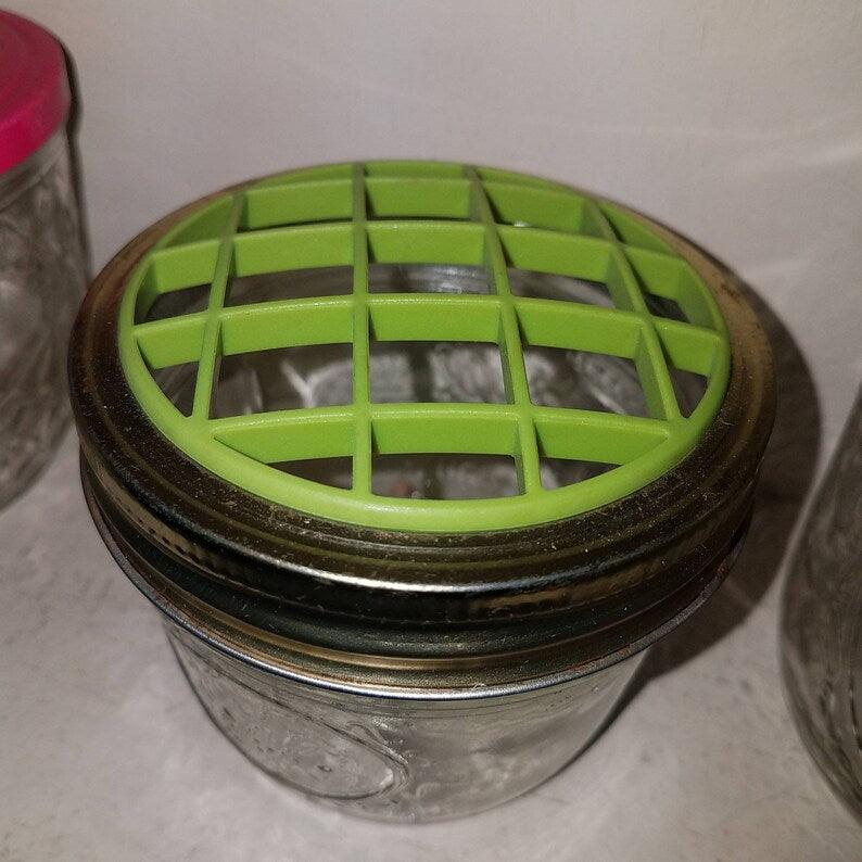 Vintage small canning jar flower frog. Green plastic flower frog lid. 1 cup size Jelly Jar.